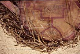 Image du Maroc Professionnelle de  Détail d'un coussin en cuir du Sud (pouf) qui fait partie de l'artisanat du sud du Maroc, cet objet teint avec des couleurs naturelles est exposé à l'extérieur d'un  Bazar accolé à la Kasbah de Taourirt à  Ouarzazate au sud du Maroc le 23 Août 1997. (Photo / Abdeljalil Bounhar)

 